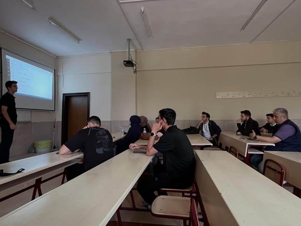 Students analyzing code during the event